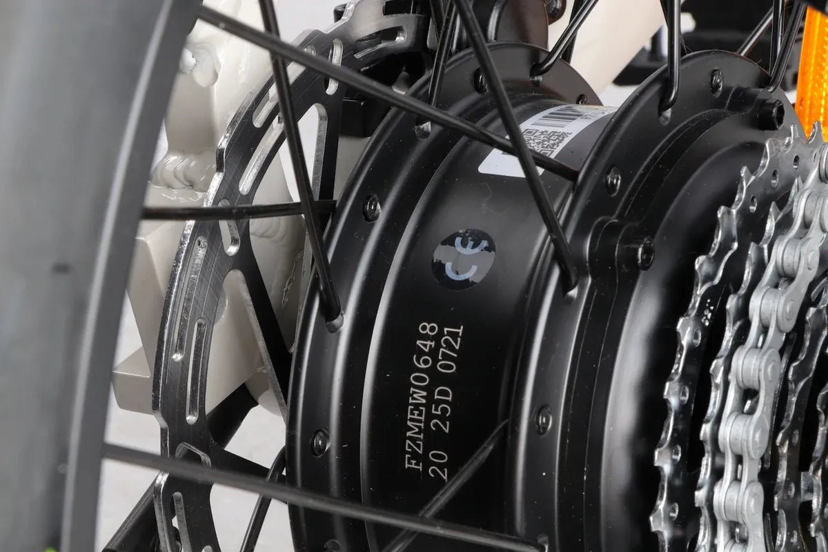 Close-up of the Miniwave folding e-bike rear hub motor beside the cassette and chain