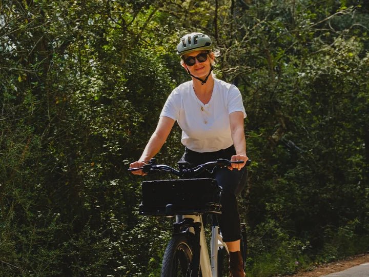 a woman riding on an ebike