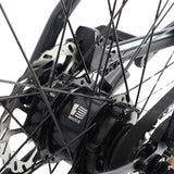 Rear hub motor, disc brake and spokes detail on the Ridewave Glide Road electric bike