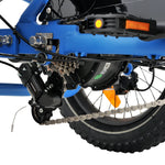 Ridewave Koala sky blue electric trike drivetrain close-up with chain, pedal and rear wheel #color_sky-blue